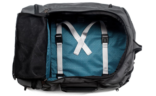 An open Techonaut 45 with a Nebulous Grey (medium grey) exterior and a Fjord (blue) interior.